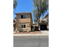 A view of the exterior elevation of the home with neutral color scheme and well-kept landscape at 5280 Shreve Ave, Las Vegas, NV 89156