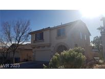 Inviting two-story home featuring desert landscaping and an attached two-car garage at 8149 Palace Monaco Ave, Las Vegas, NV 89117
