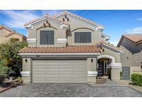 Charming two-story home with a red tile roof, neutral stucco and a spacious two car garage at 8316 Maplestar Rd, Las Vegas, NV 89128