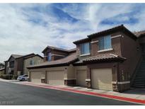 Charming condominium complex featuring private garages and well-maintained landscaping at 8324 W Charleston Blvd # 2033, Las Vegas, NV 89117