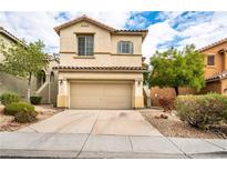 Charming two-story home with a two-car garage and well-maintained landscaping at 9750 Maple Sugar Leaf Pl, Las Vegas, NV 89148