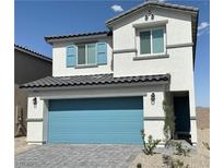 Charming two-story home with blue trim, a blue garage door and a tiled roof under a bright blue sky at 10388 Luna Mezza Ave # Lot 4195, Las Vegas, NV 89141