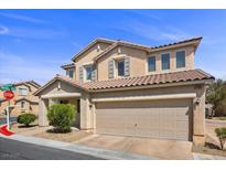 Charming two-story home features a spacious two-car garage and a well-maintained front yard at 10468 Concetta Ave, Las Vegas, NV 89129