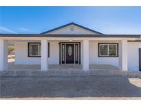 Charming single-story home featuring a decorative front door and covered porch with supporting columns at 1227 San Gabriel Ave, Henderson, NV 89002