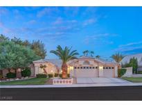 Charming single-story home with desert landscaping, a two-car garage and a tile roof at 1913 Madagascar Ln, Las Vegas, NV 89117