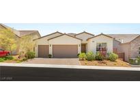 Charming single-story home with a two-car garage, desert landscaping and attractive brick paved driveway at 3395 Stone View Ave, Henderson, NV 89044