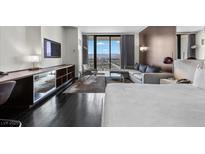 Modern bedroom with a sitting area featuring city views and modern decor at 4381 W Flamingo Rd # 3809, Las Vegas, NV 89103