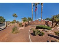 Los Prados Golf Community sign with manicured landscaping, and palm trees at 5232 Saranac Rd, Las Vegas, NV 89130