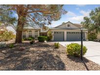 Charming single-story home with well-maintained landscaping and a spacious three-car garage at 5232 Saranac Rd, Las Vegas, NV 89130