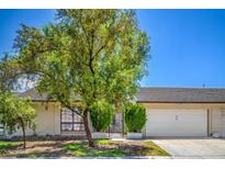 Charming single story home with desert landscaping, an attached garage, and a front gate at 5713 Whiteridge Ave, Las Vegas, NV 89107
