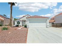 Charming single-story home featuring a well-maintained front yard and a two-car garage in a sunny setting at 628 Bay Bridge Dr, North Las Vegas, NV 89032
