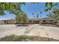Charming single-story home with mature landscaping, brick accents, and a spacious circular driveway at 6315 Eldora Ave, Las Vegas, NV 89146
