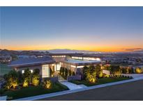 Stunning modern home with beautiful landscaping and breathtaking views at sunset at 641 Majestic Rim Dr, Henderson, NV 89012
