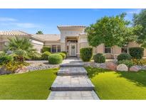 Charming single-story home featuring an inviting entrance and well-manicured landscaping at 7411 Brittlethorne Ave, Las Vegas, NV 89131
