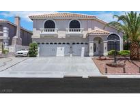 Charming two-story home featuring a three-car garage, balconies, and well-maintained landscaping at 8224 Fawn Meadow Ave, Las Vegas, NV 89149
