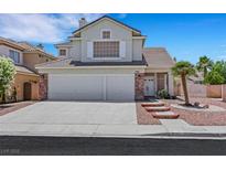 Charming two-story home featuring a three-car garage and desert landscaping at 8481 Lambert Dr, Las Vegas, NV 89147