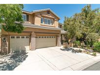 Charming two-story home featuring a three-car garage and mature landscaping, perfect for Gathering living at 10744 Balsam Creek Ave, Las Vegas, NV 89144