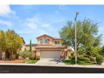 Charming two-story home with landscaped yard and a two-car garage in a well-maintained neighborhood at 11226 Kenyan Sunshine Ct, Las Vegas, NV 89138