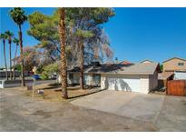 Charming single-story home featuring a two-car garage and mature trees at 1847 Stevens St, Las Vegas, NV 89115