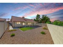 Beautiful backyard with gravel and green spaces offers a private outdoor retreat at 234 Geronimo Ct, Henderson, NV 89074