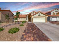 Charming single-story home featuring a two-car garage and landscaped front yard at 234 Geronimo Ct, Henderson, NV 89074