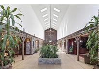 Grand hallway with stone accents, skylights, tile floor, and multiple doorways at 3330 Wedo Way, North Las Vegas, NV 89031