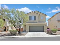 Charming two-story home featuring a two-car garage, manicured landscaping, and beautiful desert surroundings at 4132 Joyous St, North Las Vegas, NV 89032