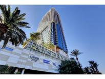 Modern high rise exterior featuring palm trees and upscale commercial spaces on the bottom level at 4381 W Flamingo Rd # 1206, Las Vegas, NV 89103