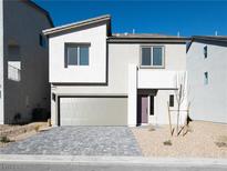 Charming two-story home featuring a modern design, two car garage and a landscaped front yard at 5904 Becklow Gardens Ave, Las Vegas, NV 89141
