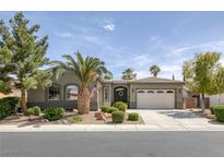 Charming single-story home featuring a landscaped front yard, mature palm trees, and a two-car garage at 6173 Sabine Ranch Rd, Las Vegas, NV 89131