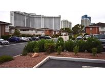 Exterior view of a multi-Gathering building with mature landscaping and ample parking at 634 Oakmont Ave # 1903, Las Vegas, NV 89109