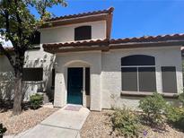 Charming two-story home featuring desert landscaping and a welcoming entrance at 8017 Cherish Ave, Las Vegas, NV 89128
