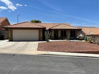 Charming single-story home with a well-maintained front yard and a two-car garage at 903 Billings St, Henderson, NV 89002