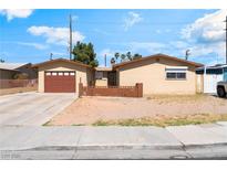Charming single-story home with a well-maintained front yard and attached garage at 908 N 24Th St, Las Vegas, NV 89101