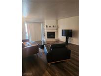 Inviting living room featuring a fireplace and comfortable seating arrangement at 2606 S Durango Dr # 214, Las Vegas, NV 89117