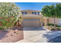 Charming two-story home featuring desert landscaping, a two-car garage, and a tile roof at 305 Napa Hills Dr, Las Vegas, NV 89144