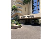 Inviting Regency Towers entrance featuring manicured landscaping and porte cochere at 3111 Bel Air Dr # 22B, Las Vegas, NV 89109