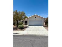 Charming single-story home featuring a well-maintained front yard, desert landscaping, and an attached two-car garage at 3665 Lucky Horseshoe Ct, Las Vegas, NV 89129