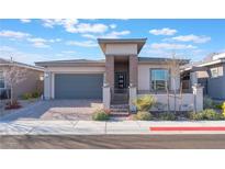 Beautiful single-story home with desert landscaping and a modern exterior design, including an attached two-car garage at 421 Point Sur Ave, Las Vegas, NV 89138