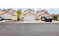 Charming two-story home featuring a well-maintained front yard and a two-car garage at 4552 Aviation St, Las Vegas, NV 89115