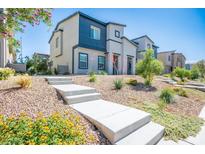 Beautiful two-story home with modern architectural design and desert landscaping at 532 Clearsable Ave, Henderson, NV 89044