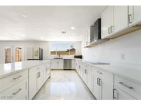 Bright kitchen featuring stainless steel appliances and modern white cabinetry at 5336 Regal Ave, Las Vegas, NV 89146