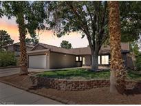 Charming single-story home featuring a well-manicured lawn, desert landscaping, and a two-car garage at 6436 Vinecrest Ave, Las Vegas, NV 89108
