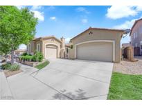Charming single-story home featuring a three-car garage and meticulously landscaped front yard at 9375 Gold Lake Ave, Las Vegas, NV 89149