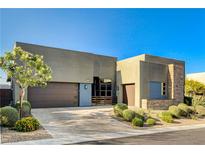 Contemporary home with clean lines, desert landscaping, and a modern design at 10228 Shell Star Ave, Las Vegas, NV 89135