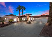 Charming single Gathering home showcases a circular driveway and lush landscaping at 1105 Malachite Ct, Henderson, NV 89011