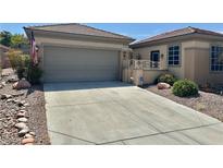 Charming single story home with a two car garage and well maintained landscaping at 2138 Grand Traverse St, Henderson, NV 89052