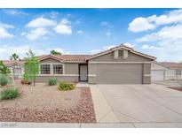 Charming single-story home featuring a low-maintenance desert landscape and a two-car garage at 3102 Honeysuckle Ave, North Las Vegas, NV 89031