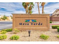 Mesa Verde community sign with desert landscaping, palm trees, and bright blue sky at 3728 Juanita May Ave, North Las Vegas, NV 89032