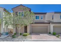 Charming two-story home featuring a well-maintained yard, a two-car garage and a classic stucco exterior at 5244 Fiery Sky Ridge St, Las Vegas, NV 89148